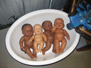Rub-a-dub-dub, four sorta creepy babies in a tub