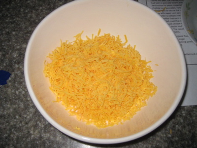 Cheese: Grated.  Fingers: Surprisingly unbloodied!