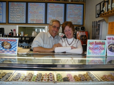 The owners Tony and Susan in front of a full case of their wares (courtesy of Hartford.com)