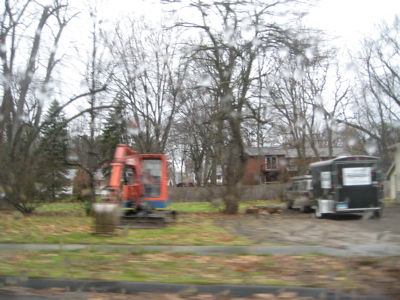 The driveway is in MA, but the house was in CT.  There were two cars in the driveway, one with a CT plate and one with a MA plate.  That backhoe is used to bury those who give their lives to the Baby Jog struggle.