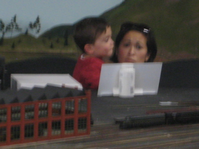 Despite the blurry distance shot, you can see Hoang’s joy at having to hold Damian to see the train come around the 300th time!