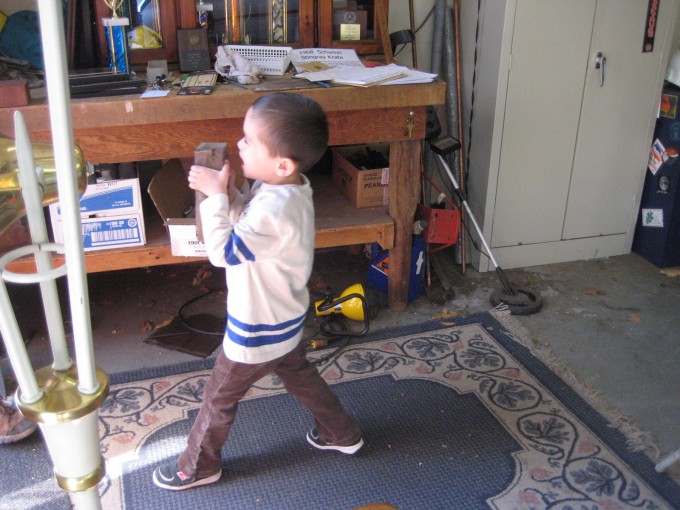 Damian carrying a brick for some reason.