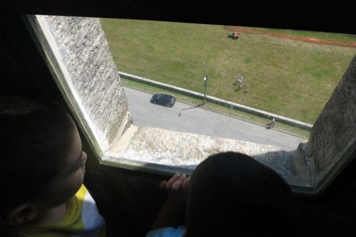 The boys looking down at our car.