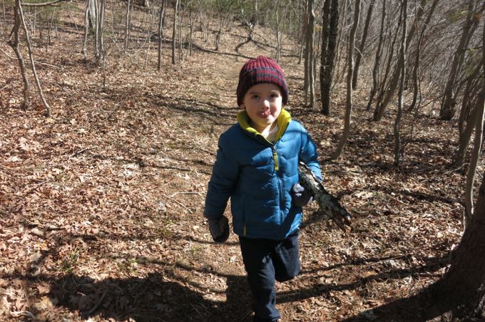 His spirit picked up with a rock in one hand and a log in the other, with a nice throwing session ahead of him.